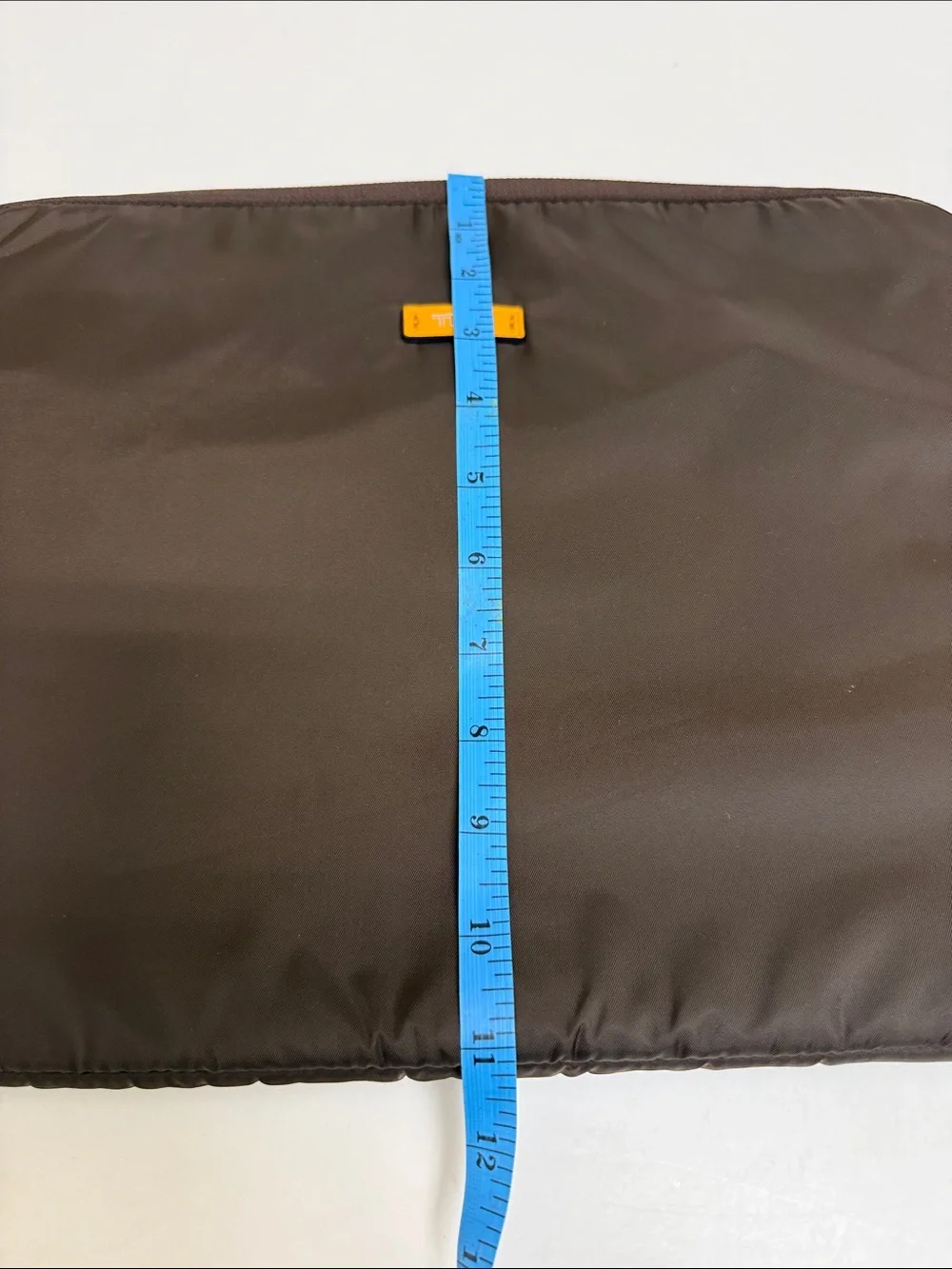 Tumi Brown Laptop Sleeve with Orange Logo Accent